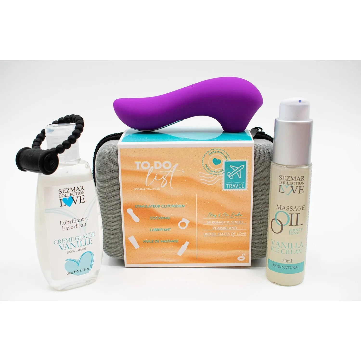 Coffret Box Hot Summer avec huile massage vanille, lubrifiant naturel et stimulateur violet, fond blanc.