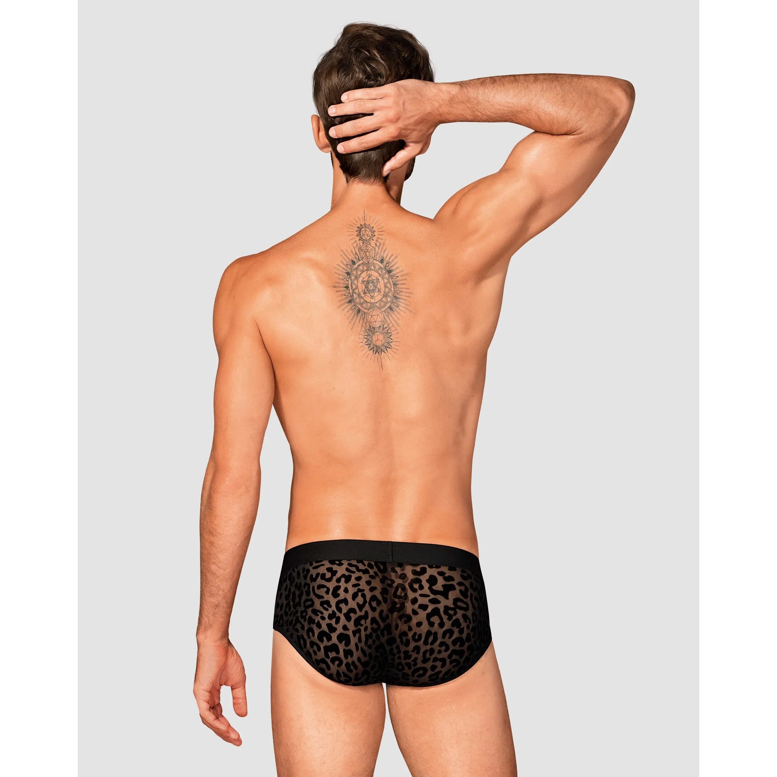 Slip homme Azmeron noir, imprimé léopard, détails translucides et argentés, coupe classique et élégante.
