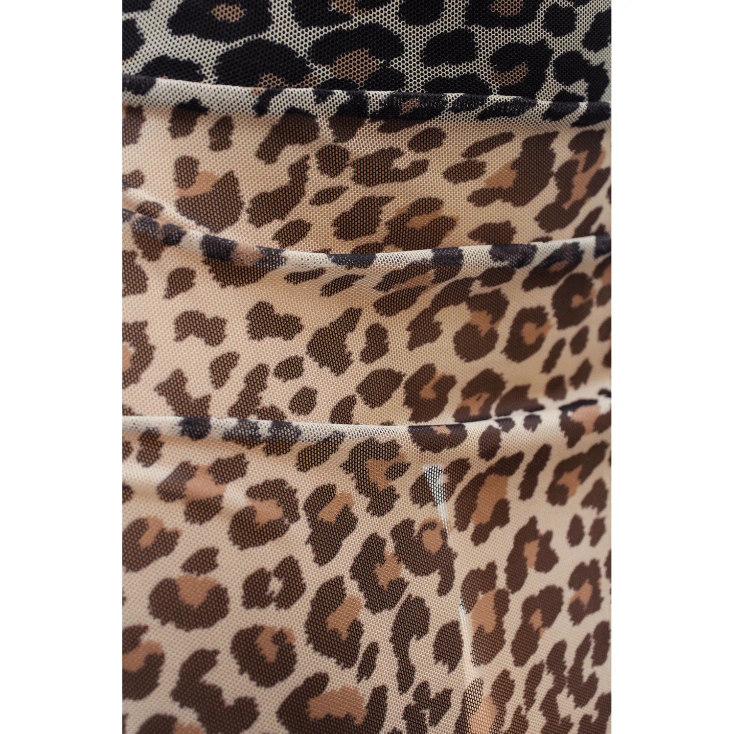 Jupe Courte Clara Résille Transparente Imprimé Léopard Ultra-Féminine Sensualité Style Mouvements Fluides Soirées Privées Clubbing Lingerie Audacieuse