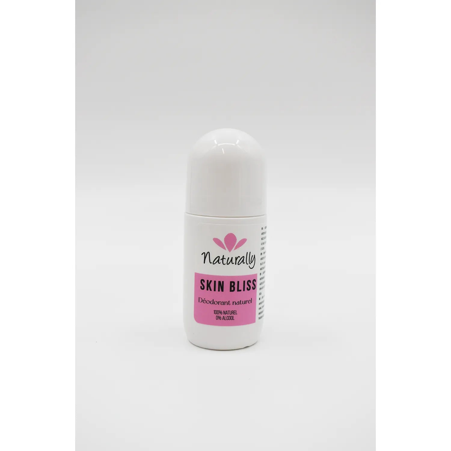 Déodorant roll-on naturel sans aluminium, flacon blanc avec étiquette rose, parfum vanille bergamote, peau sensible.