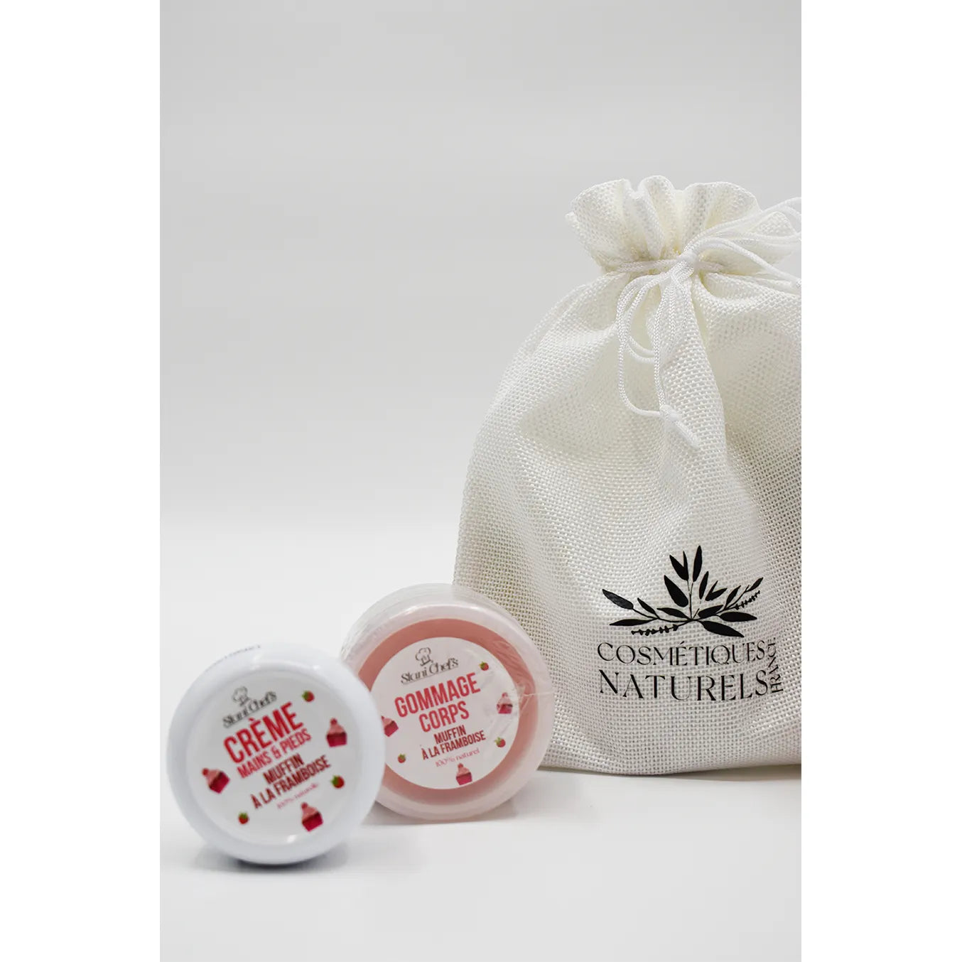 Coffret découverte muffin à la framboise, lait corporel et hydratant, emballage blanc élégant, soin naturel.