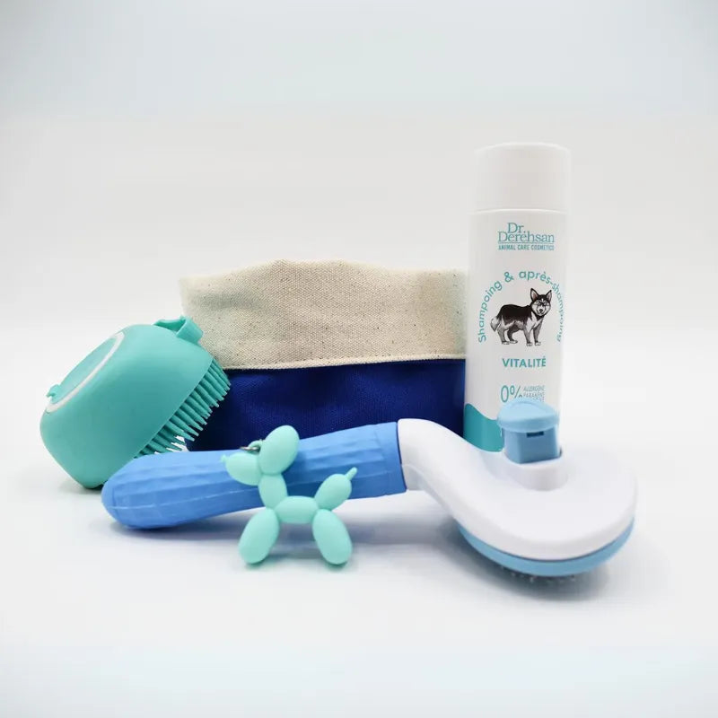 Box pour chien avec shampoing, brosses et porte-clé dans une panière en tissu, choix parmi 7 shampoings spécifiques.