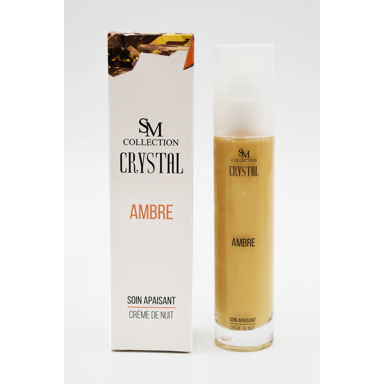 Flacon crème nuit ambre 50ml, design élégant, étiquette dorée, boîte assortie, soin apaisant peaux sensibles.