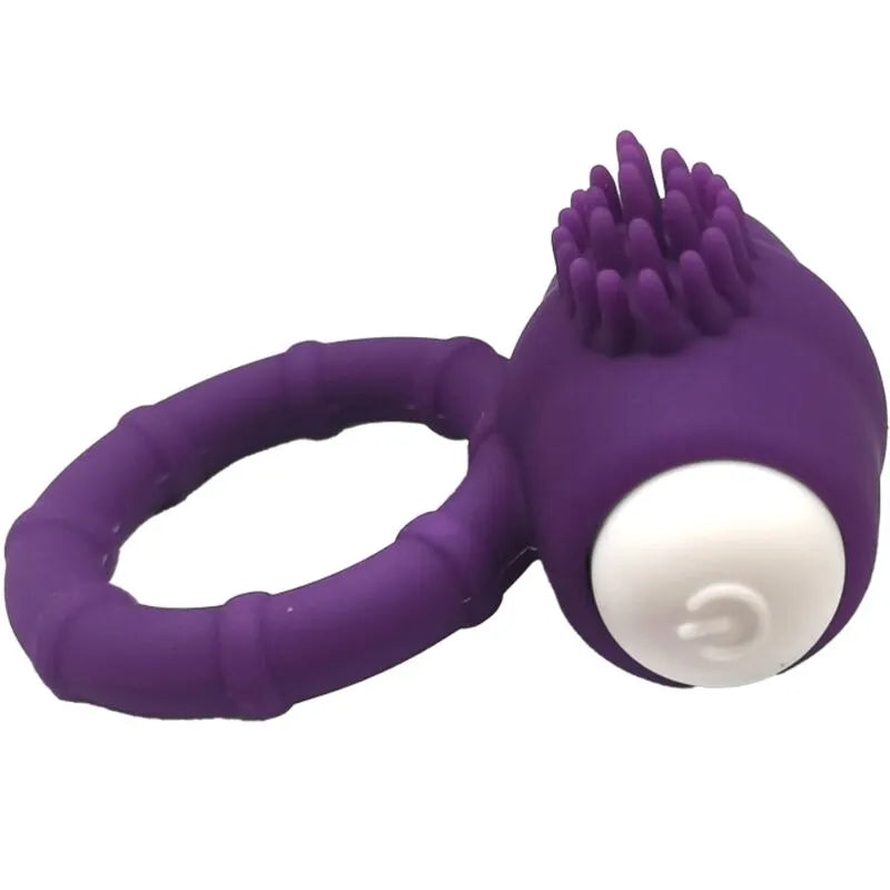 Anneau vibrant submersible en silicone médical violet avec texture stimulante et bouton blanc, idéal pour plaisir aquatique.