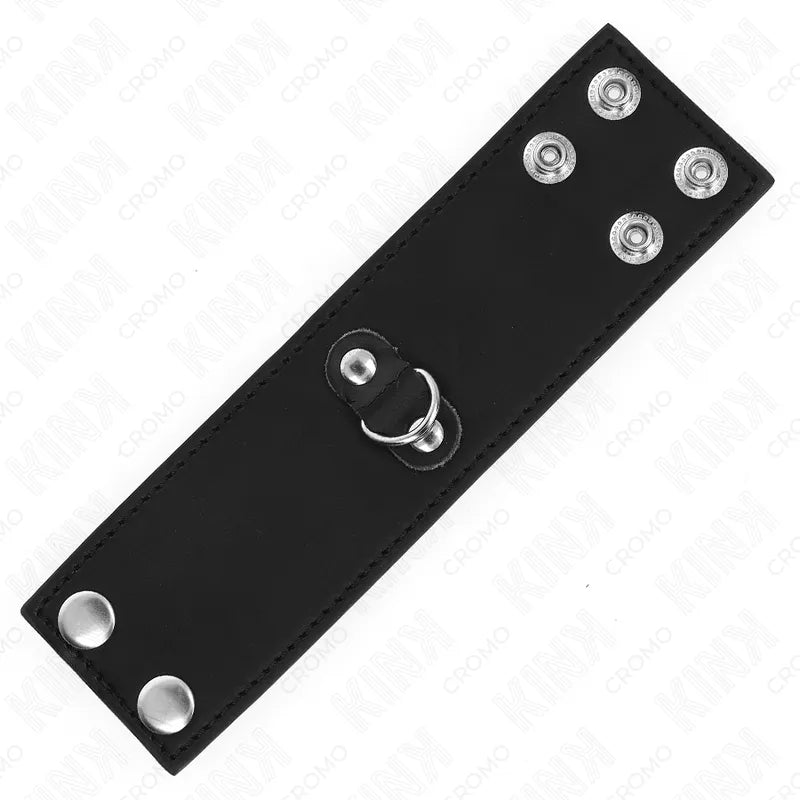 Anneau pénien ajustable en cuir noir avec boutons-pression, accessoire BDSM pour contrôle et plaisir intensifié.