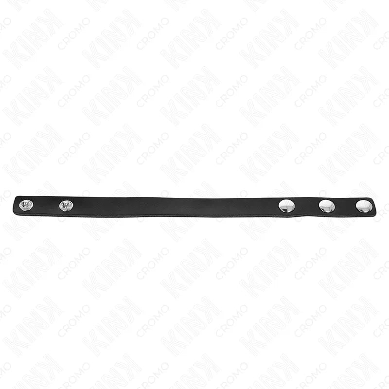 Anneau pénien ajustable en cuir noir avec boutons-pression, accessoire BDSM pour contrôle et stimulation intimes.