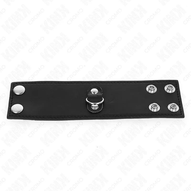 Anneau pénien ajustable en cuir noir avec boutons-pression, accessoire BDSM pour plaisir et contrôle intensifiés.
