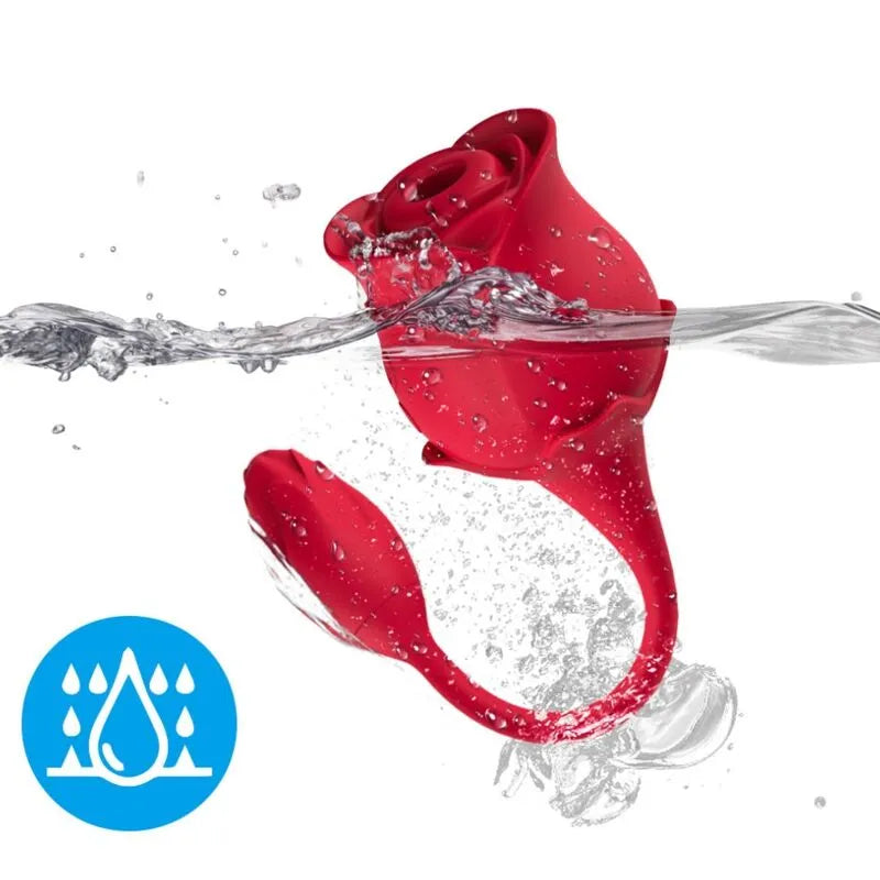 Appareil aspiration clitoridienne étanche Armony rouge en silicone, forme de rose, immergé dans l'eau, design innovant.