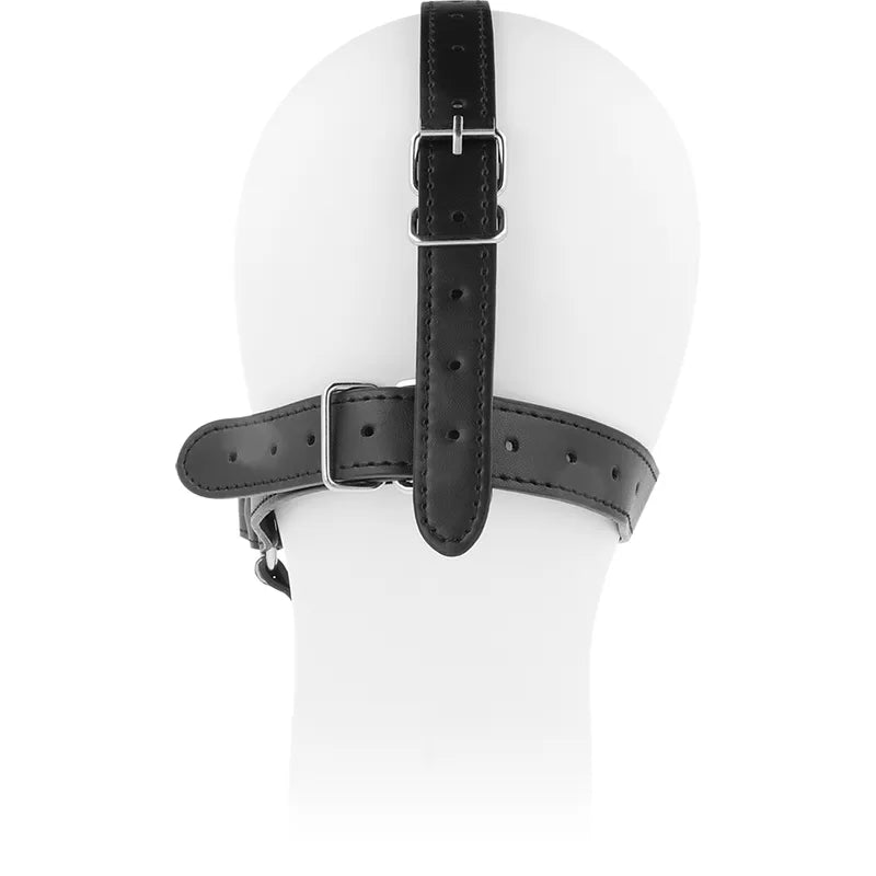 Bâillon harnais BDSM en acier inoxydable avec sangles noires ajustables, présenté sur un mannequin blanc.