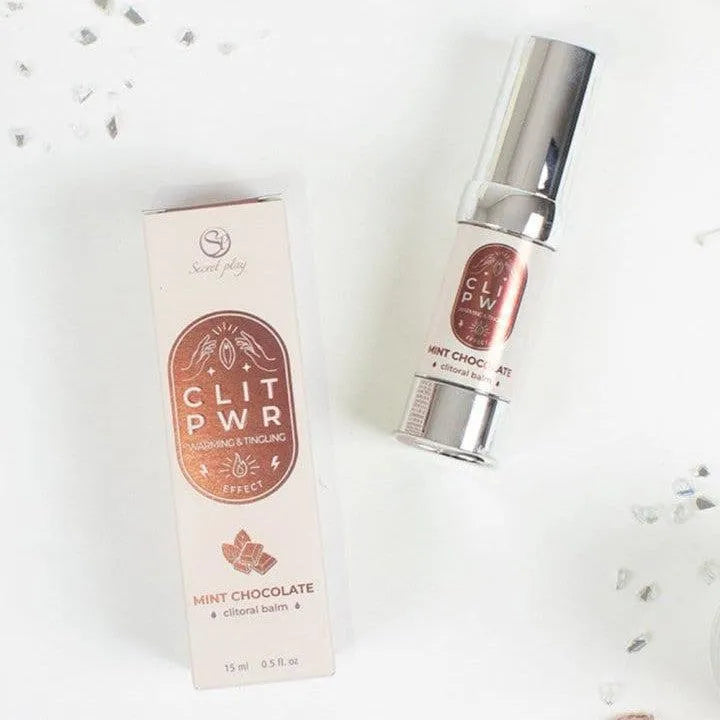 Baume chauffant clitoris menthe chocolat, flacon argenté et boîte beige, expérience sensorielle unique.