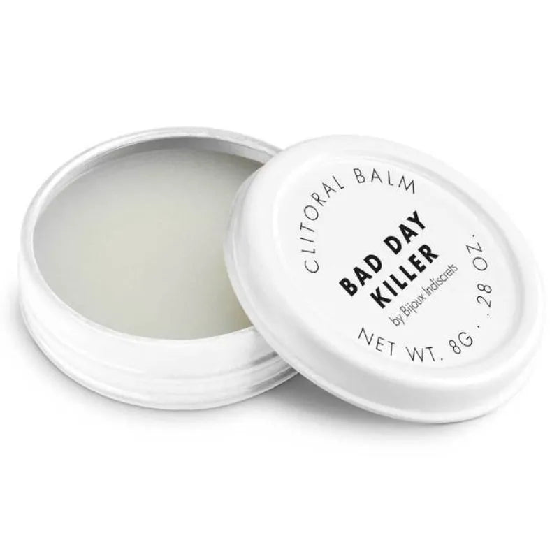 Baume clitoridien chauffant parfumé 8g, pot blanc ouvert, texture crémeuse, intensifie les sensations bien-être.