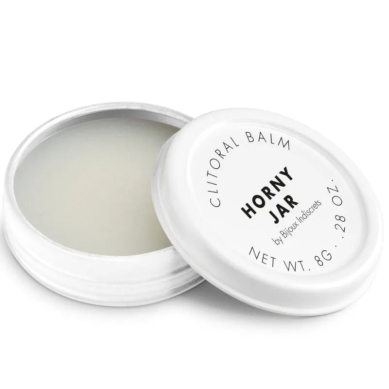 Baume clitoridien effet chauffant, pot blanc ouvert, texture crémeuse, intensifie le plaisir intime, 8g.