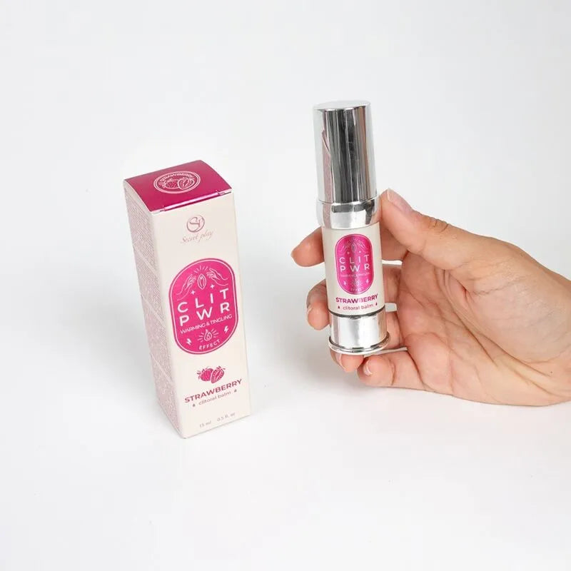 Baume stimulant clitoris fraise, flacon argenté et boîte rose, intensifie plaisir féminin avec chaleur et vibration.