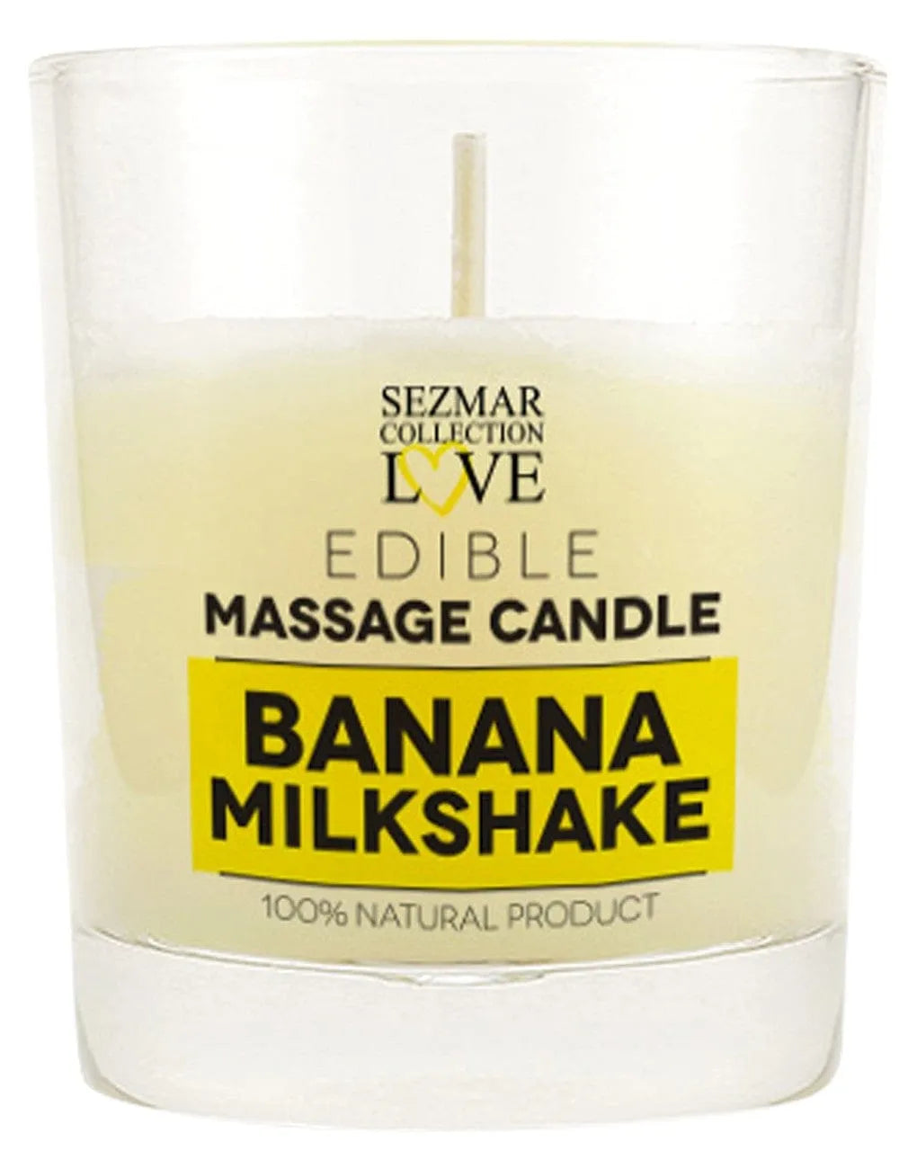 Bougie de massage blanche dans un verre transparent, étiquette jaune Banana Milkshake, ambiance détente parfumée.