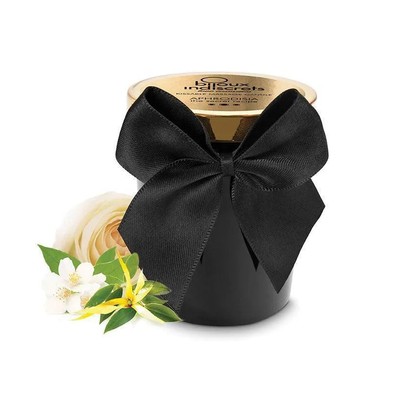 Bougie de massage noire avec couvercle doré, ruban noir, fleurs de rose et jasmin, parfum Aphrodisia sensuel.