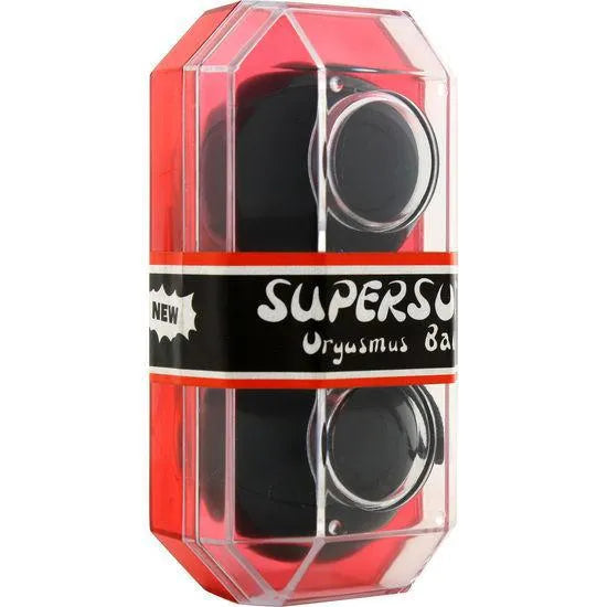 Boules de Geisha noires en vinyle vibrant dans un emballage transparent et rouge, accessoire de plaisir et stimulation.