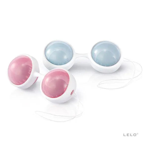 Boules de Kegel ajustables blanches avec inserts roses et bleus, pour tonus pelvien post-accouchement.