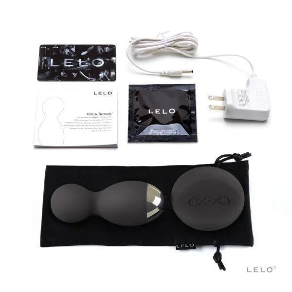 Boules de plaisir rotatives noires en silicone avec télécommande, chargeur et pochette, pour stimulation intime précise.