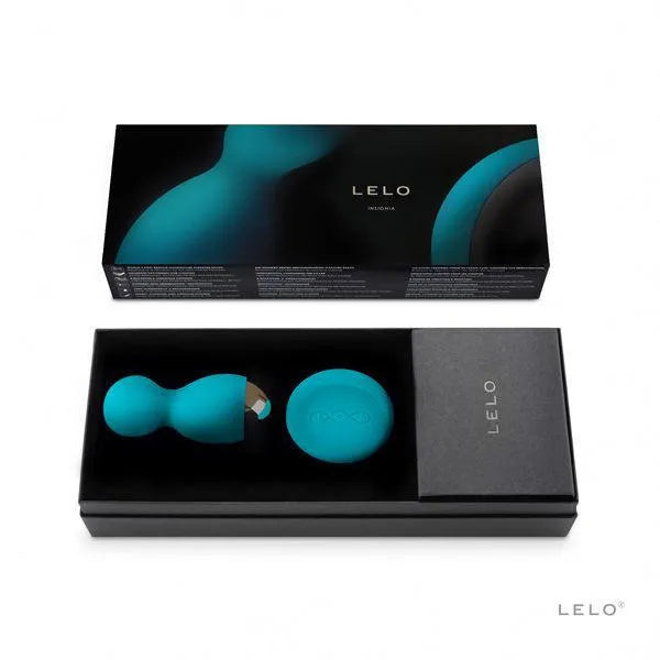 Boules de plaisir bleues rotatives vibrantes avec télécommande, présentées dans un coffret élégant noir.