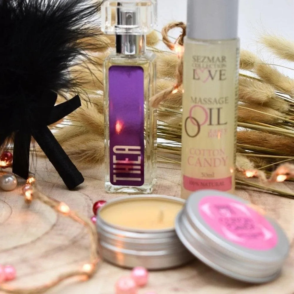 Box Bien-Être Naturelle: huile de massage, parfum violet, bougie, décorations festives, ambiance détente.