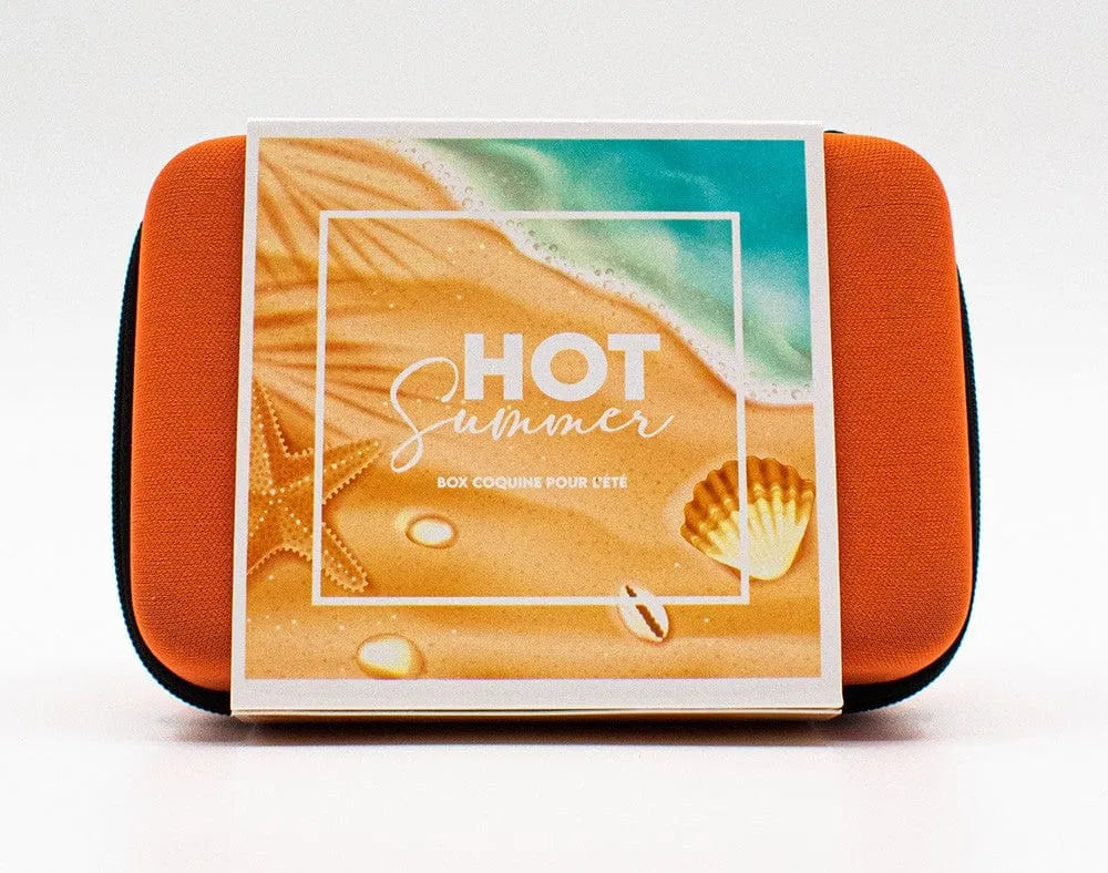 Étui orange Box Hot Summer avec plage illustrée, contenant produits naturels Monoï pour couples.
