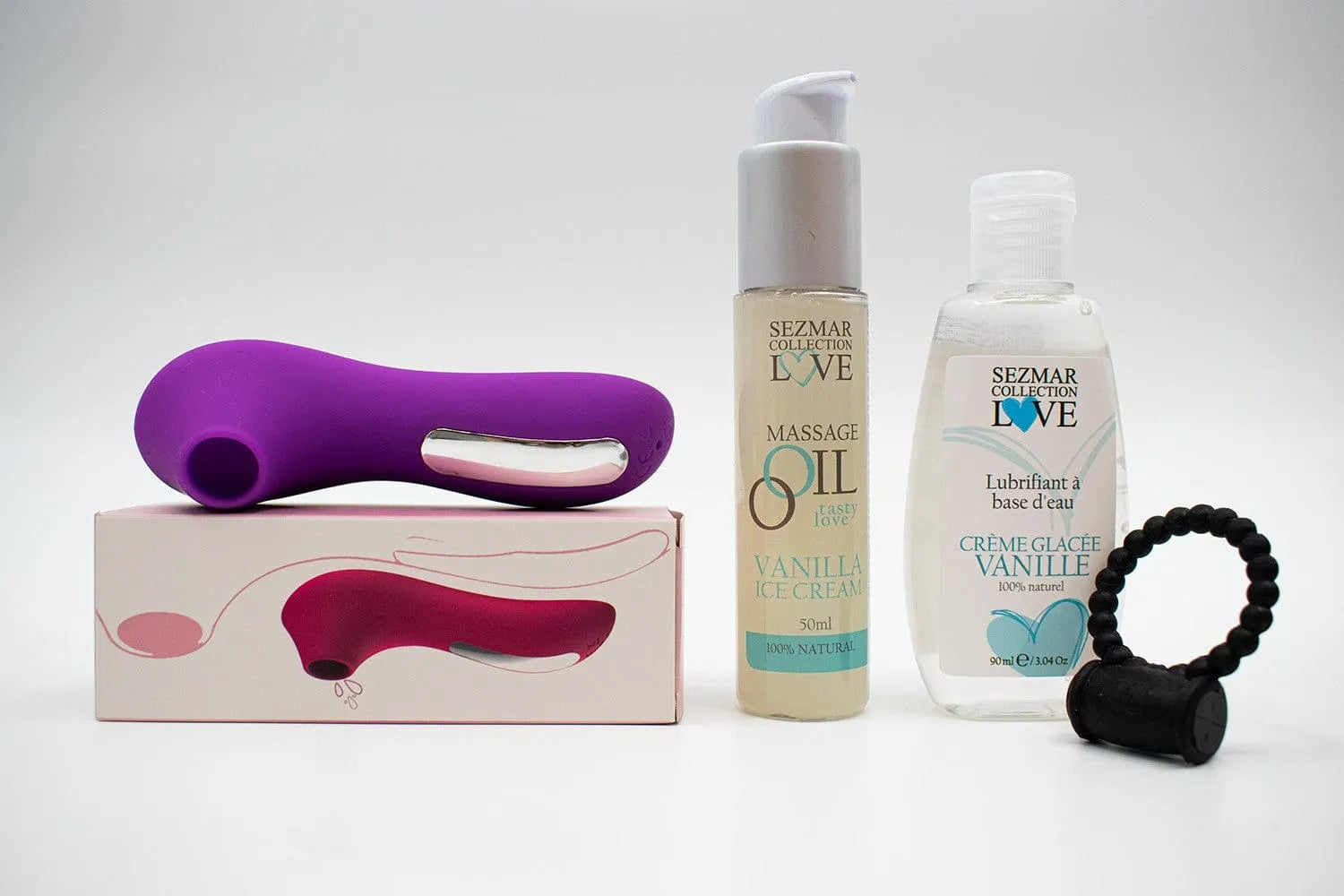 Box Couple Été Vanille avec stimulateur violet, huile de massage et lubrifiant vanille, anneau vibrant noir.
