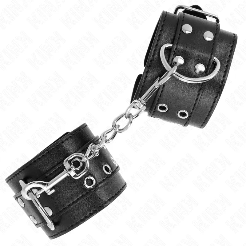 Bracelets BDSM en cuir noir élégant avec boucles métalliques et chaîne, design raffiné pour confort et sécurité.