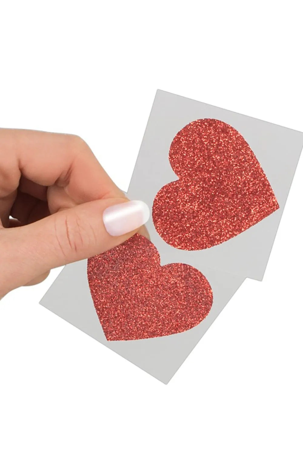 Cache-tétons rouges scintillants en forme de cœur, élégants et adhésifs, pour sublimer tenues topless et lingerie sexy.