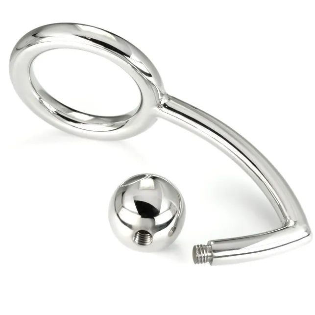 Cockring BDSM en acier chirurgical avec boule anale intégrée, design ergonomique et finition lisse, pour sensations intenses.