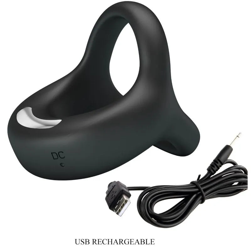 Cockring noir en silicone avec vibrations rechargeables, finition veloutée, sangle ajustable, câble USB inclus.