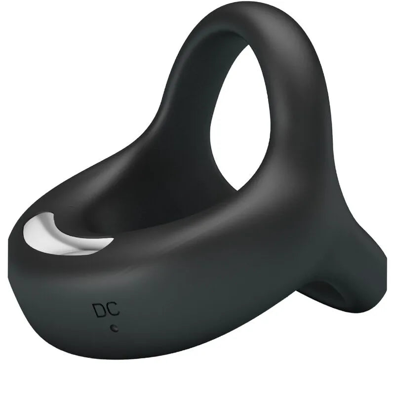 Cockring noir en silicone avec vibrations, finition veloutée, sangle ajustable, design ergonomique pour confort et plaisir.