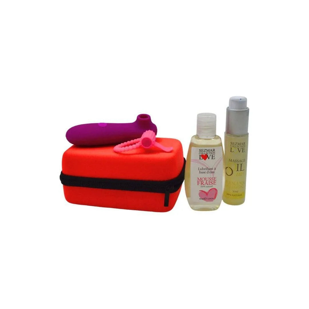 Coffret Couple Été: accessoires intimes naturels, étui rouge, huiles, stimulateur rose, moments de complicité estivale.