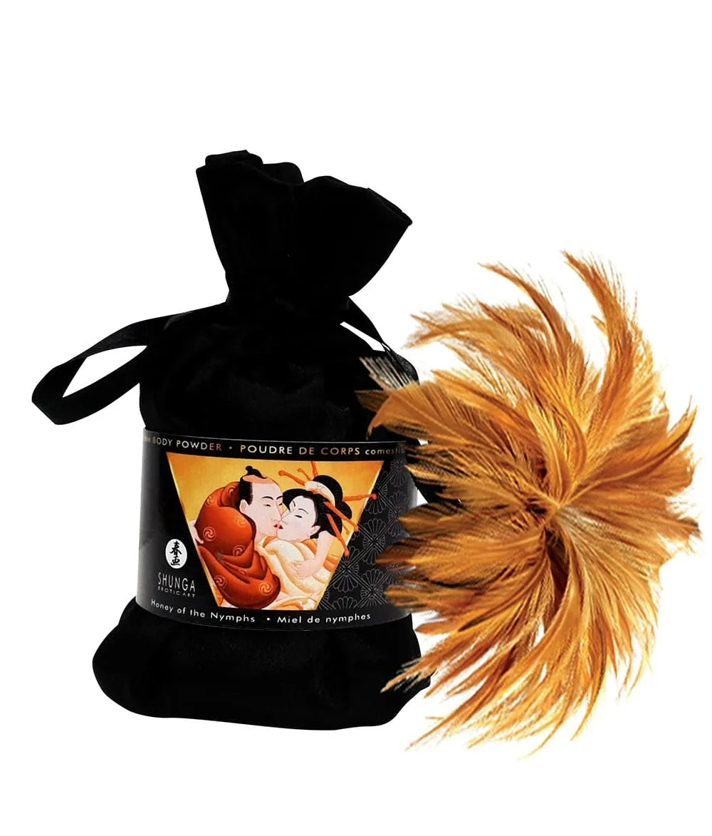 Coffret massage érotique noir avec plume dorée, produits aphrodisiaques, design élégant pour moments sensuels.