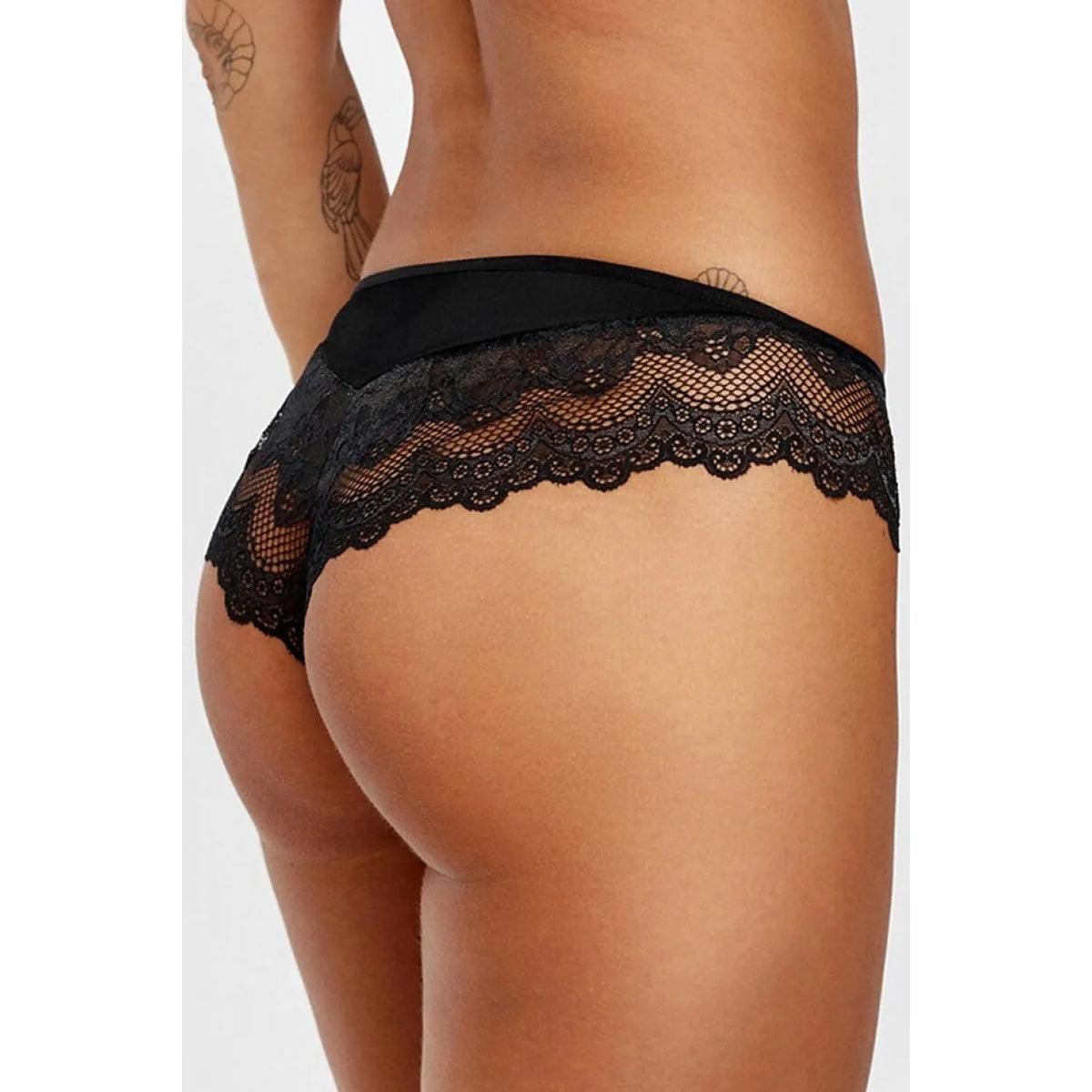 Culotte brésilienne noire en dentelle Otylia, motif délicat, filet transparent, dos ondulé, élégance féminine.