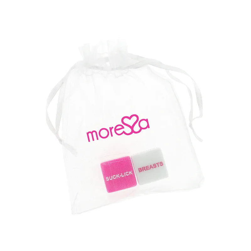 Dés érotiques Moressa en résine rose et blanc dans un sac transparent, sans phthalates, pour soirées sensuelles.
