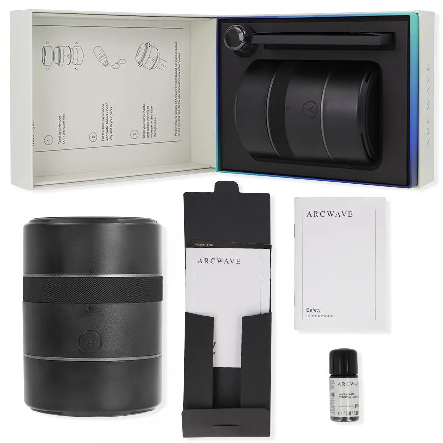 Stroker Arcwave Voy noir compact, design cylindrique, dans boîte ouverte avec manuel, huile et accessoires inclus.