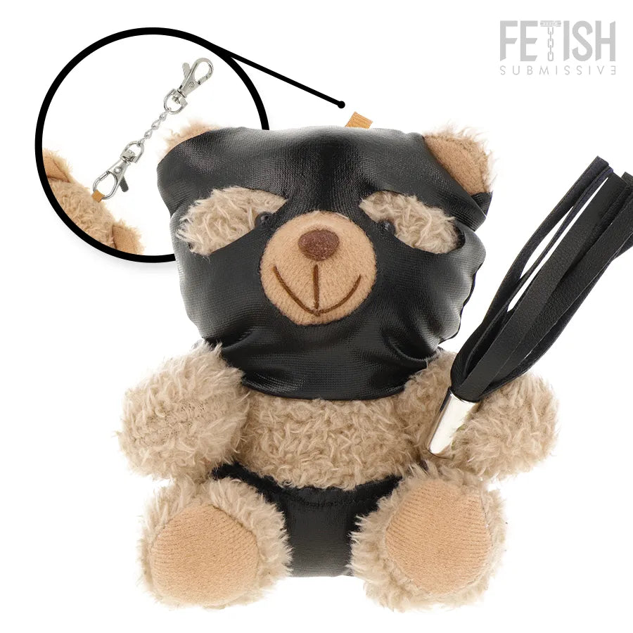 Ours en peluche Luno BDSM, beige avec masque et harnais noirs, tenant un fouet, collection Fetish Submissive.