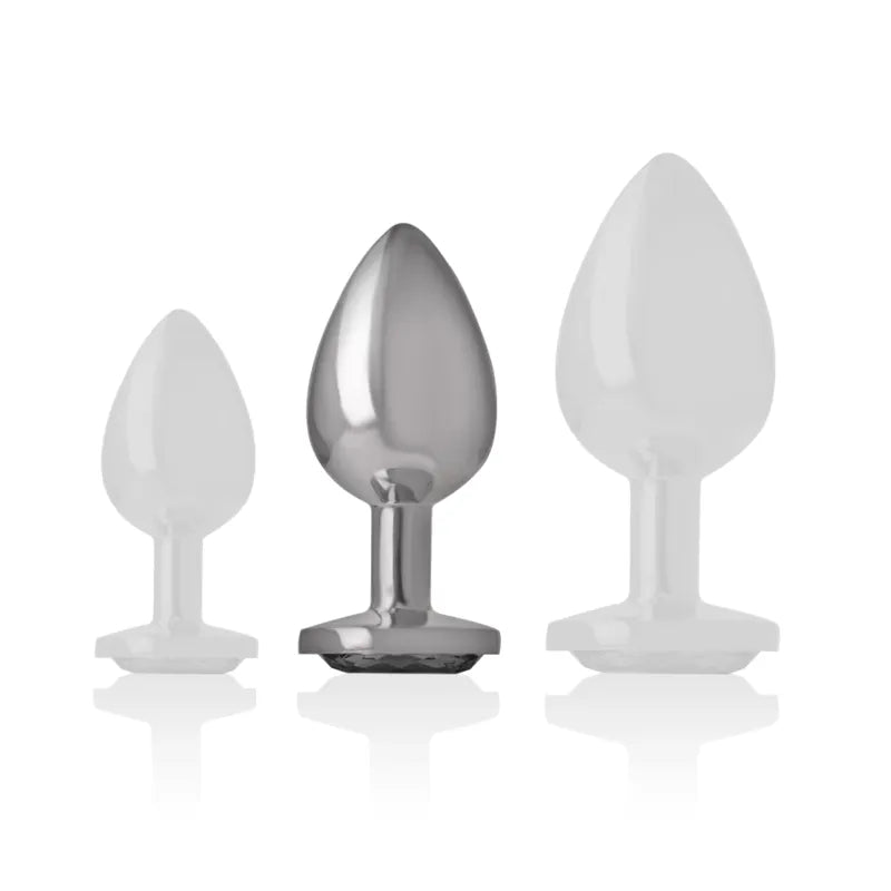 Plug anal en métal argenté avec diamant scintillant, forme conique élégante, luxe et stimulation sensorielle.