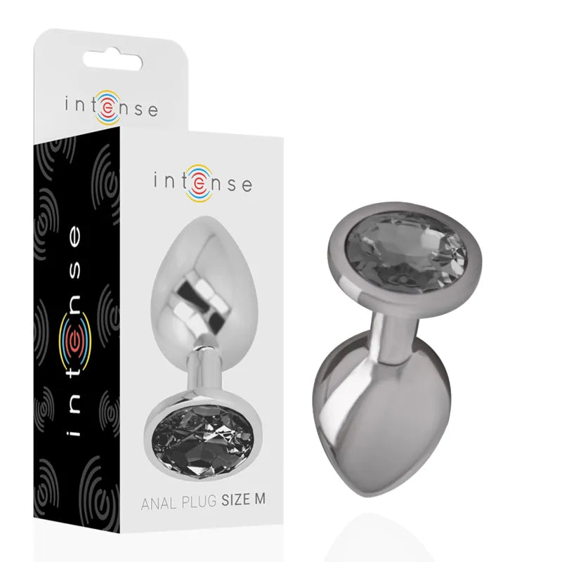 Bijou anal métal argenté avec pierre diamantée scintillante, design élégant, luxe et stimulation intime.