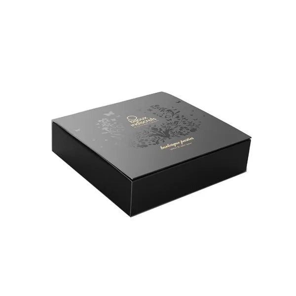 Cache-tétons noirs pailletés avec nœuds en satin, style burlesque, élégance et sensualité pour tenues glamour.