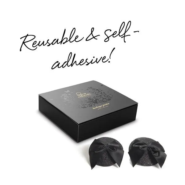 Cache-tétons noirs pailletés avec nœuds satin, style burlesque, boîte élégante, accessoire lingerie séduisant.