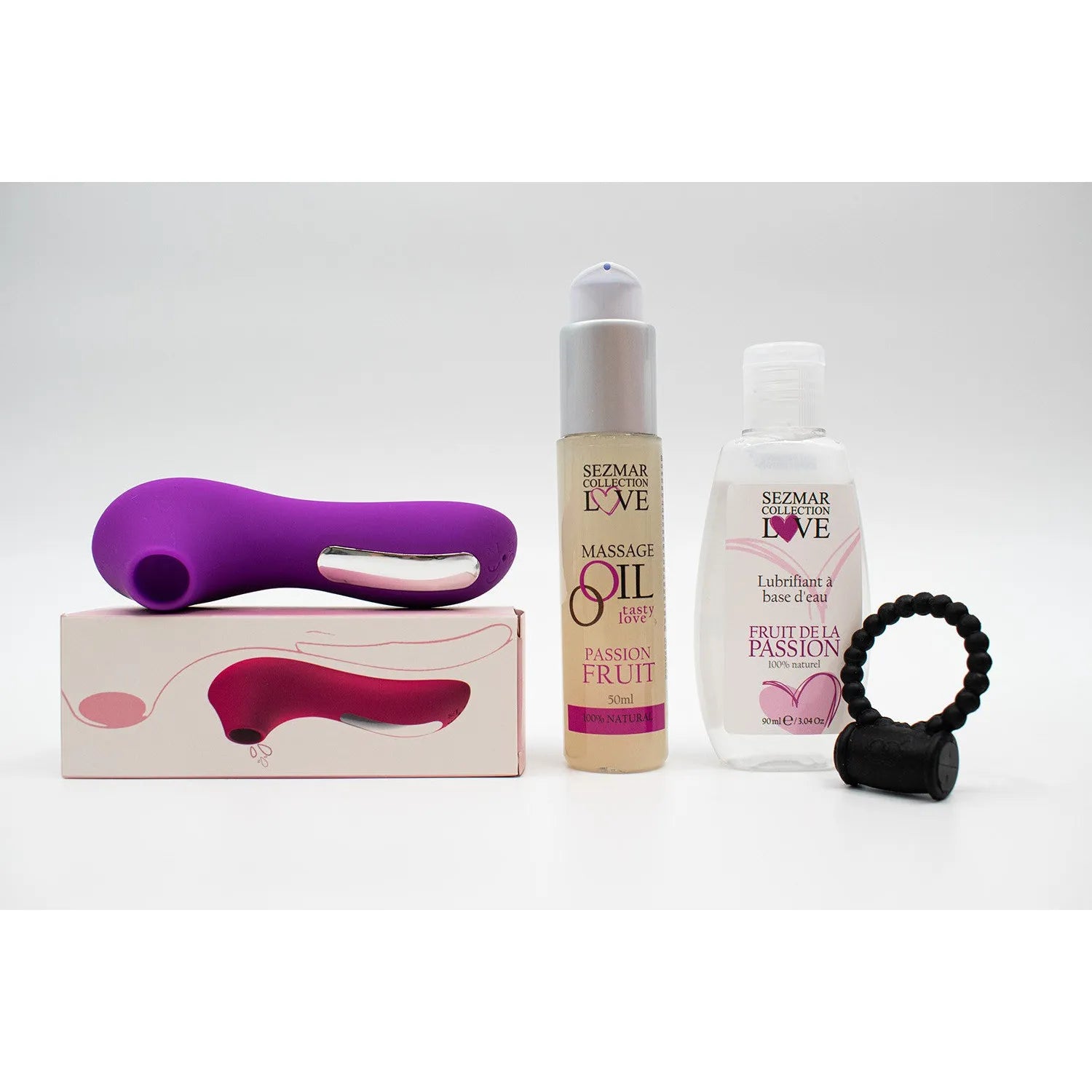 Box couple été avec stimulateur violet, huile massage fruitée et lubrifiant passion, accessoires pour moments intimes.