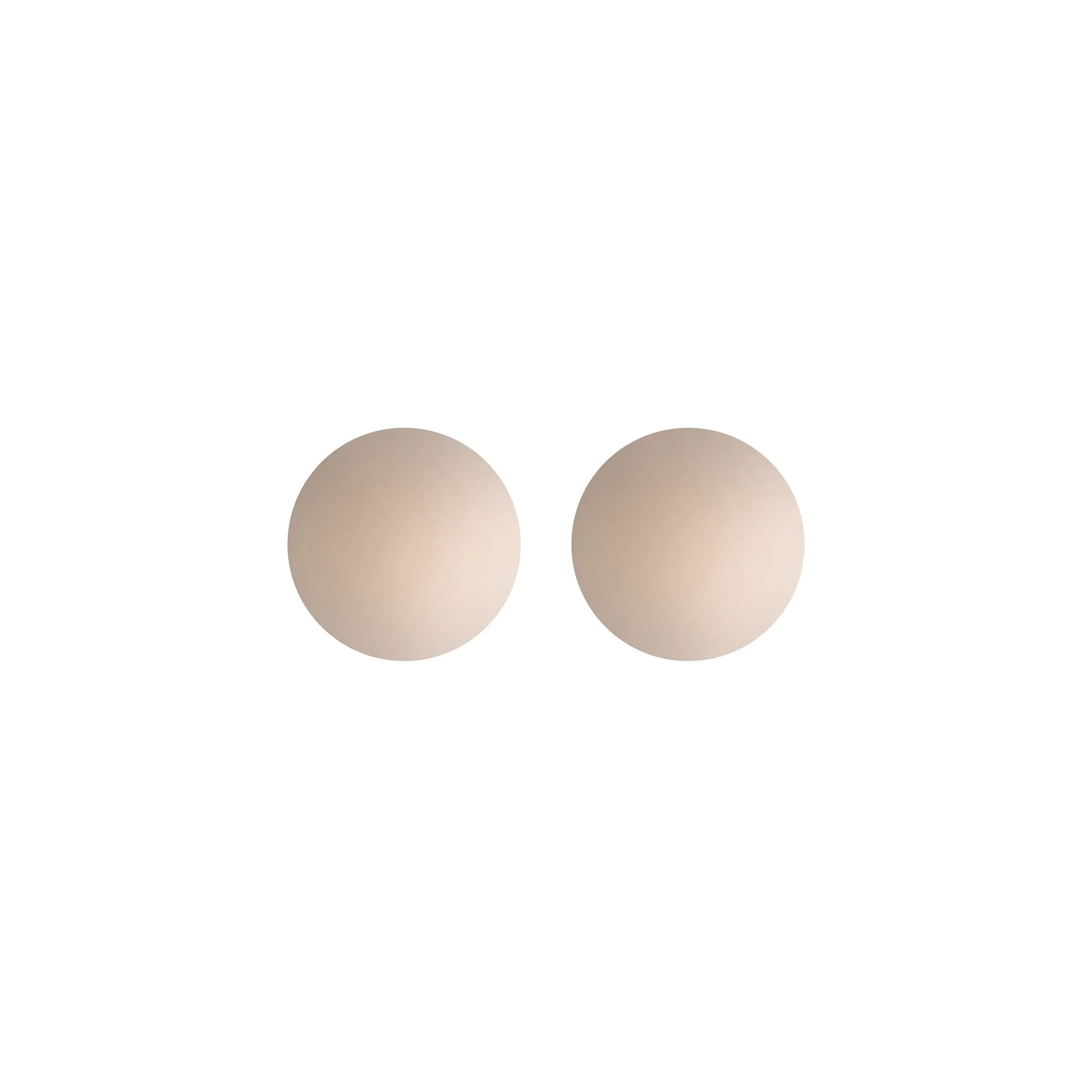 Cache-tétons silicone nude réutilisables, ronds et auto-adhésifs, finition lisse, confort discret sous vêtements.