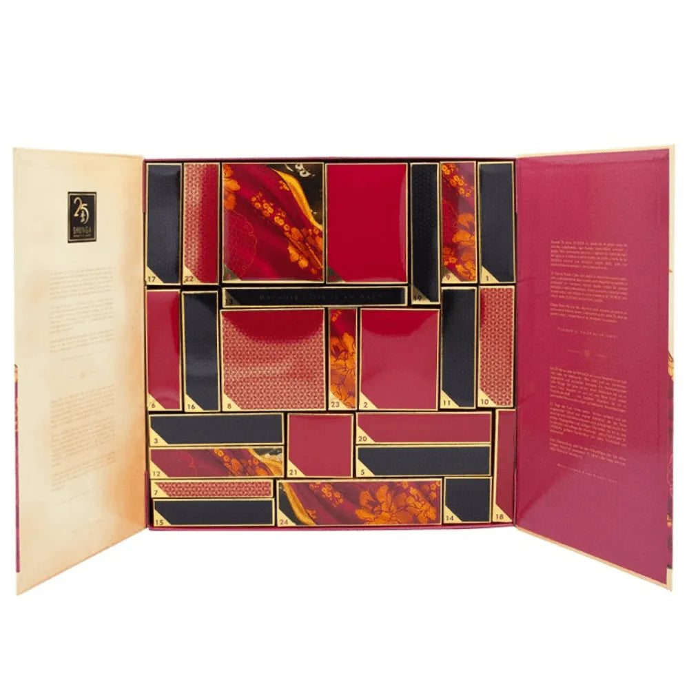Calendrier de l'Avent SHUNGA 25ème anniversaire, design luxueux rouge et or, 25 cases, produits intimes exclusifs.