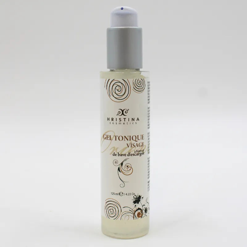 Flacon de gel tonique visage à la bave d'escargot, 125ml, bouchon gris, étiquette blanche avec motifs dorés.