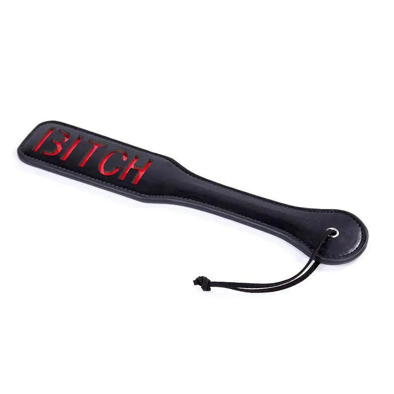 Pagaie BDSM en PVC noir avec inscription rouge, design robuste, idéale pour novices et experts, dimensions 32,6 cm.