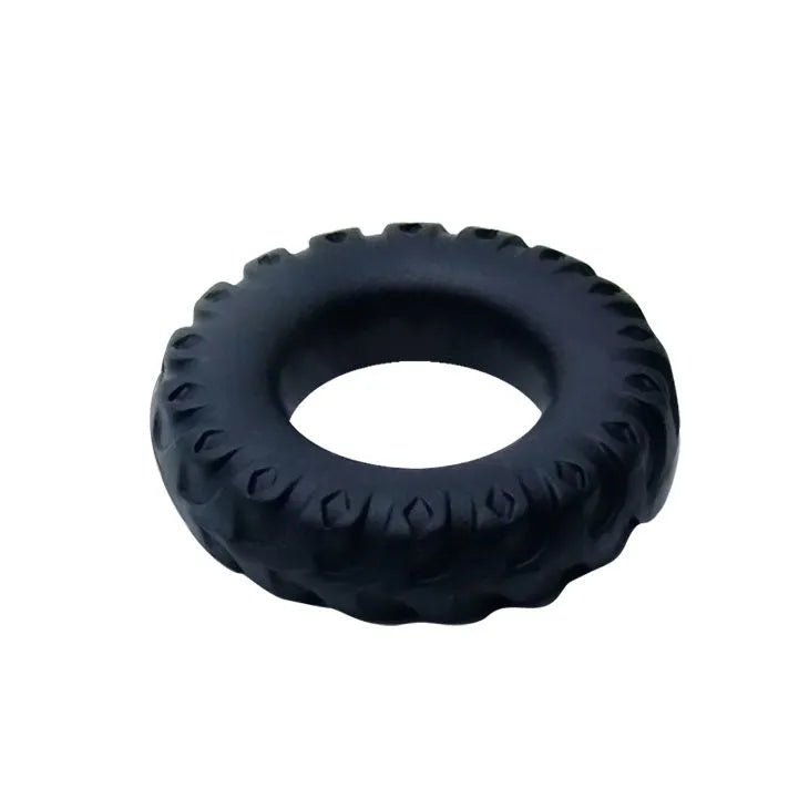 Bague de serrage silicone noire, texturée, pour retarder l'éjaculation et prolonger le plaisir intime.