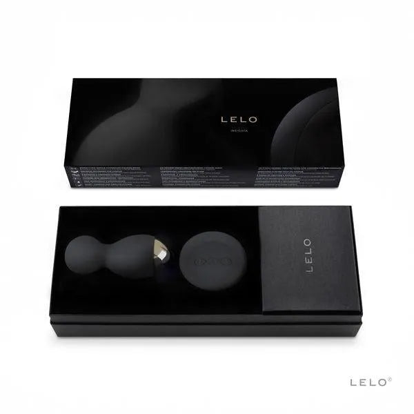 Boules de plaisir rotatives noires en silicone avec télécommande, présentées dans un élégant coffret noir.