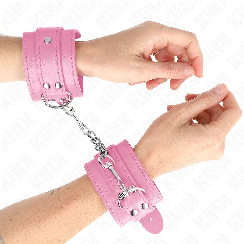 Bracelets de poignet BDSM en cuir rose, chaîne métallique, design élégant et durable, pour séances sécurisées et stylées.