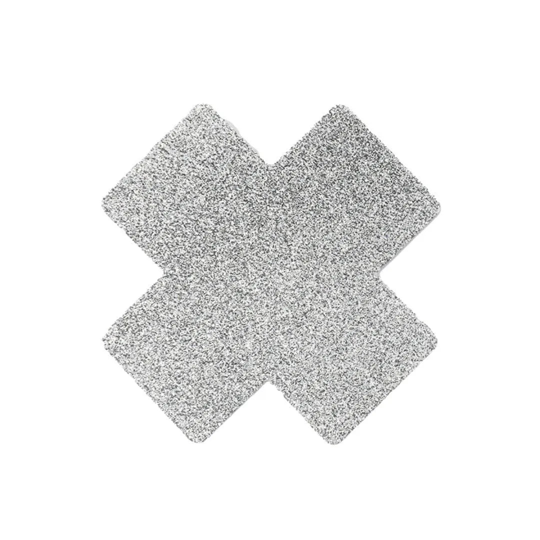 Cache-tétons croix blanche pailletée adhésive, design élégant et discret, idéal pour occasions spéciales et glamour.